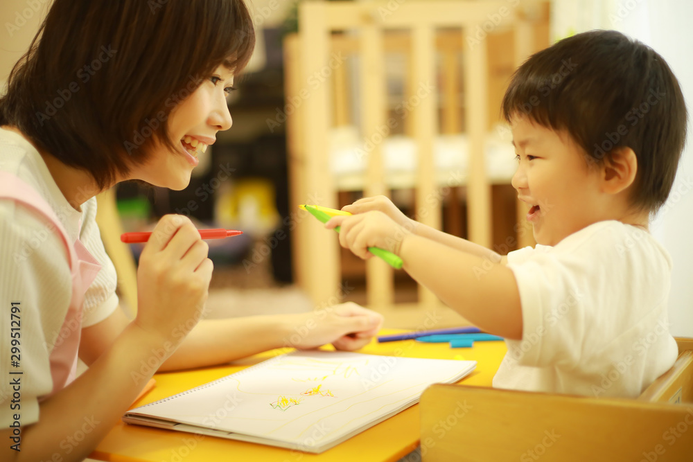 向き合う先生と子供